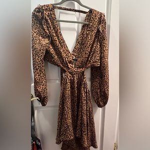New-Never Worn. Cheetah print cutout skater dress.